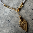 Close-up of the brass charm on the Marie Moonstone Bracelet