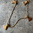 Close-up of the hanging charms on the Bali Anklet