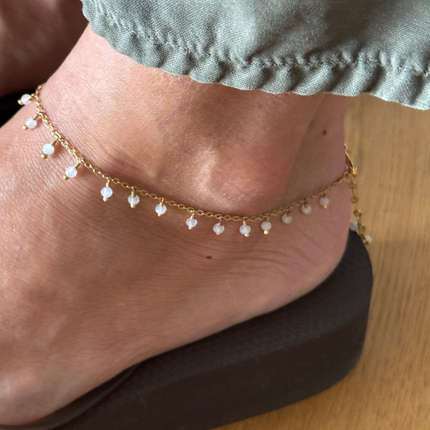 Kalyani Moonstone Anklet worn on the ankle with a platform flip flop
