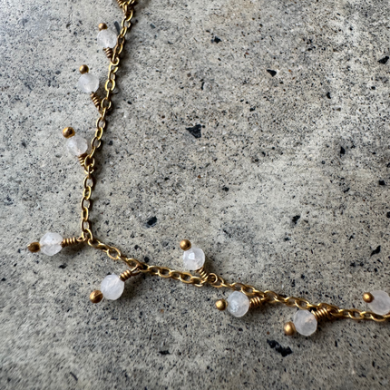 Kalyani Moonstone Anklet, brass chain with moonstone beads, laid flat