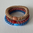 Set of 3 KKNEKKI woven hair ties in blue, red and gold